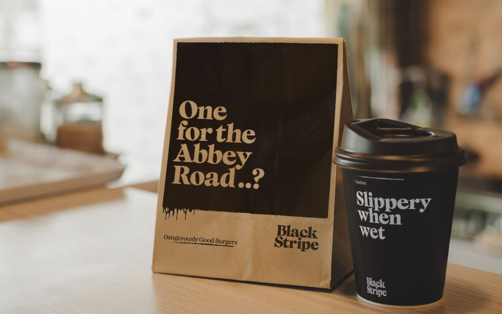 Black Stripe. Tent card and coffee cup branding