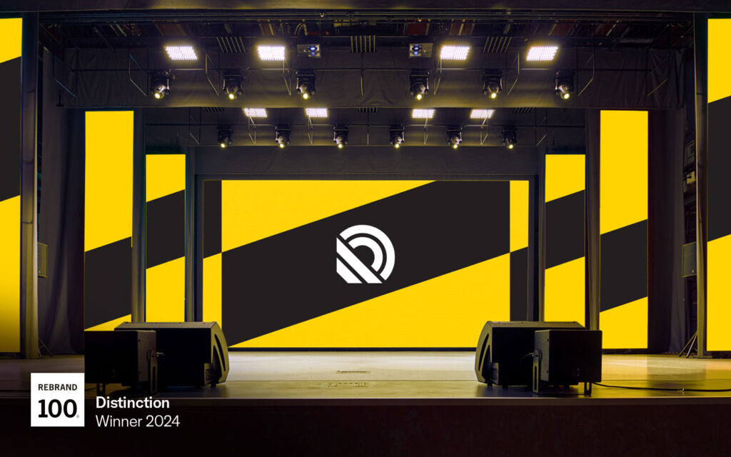 Backdrop image with white icon on black-yellow pattern for Radio Bahrain.