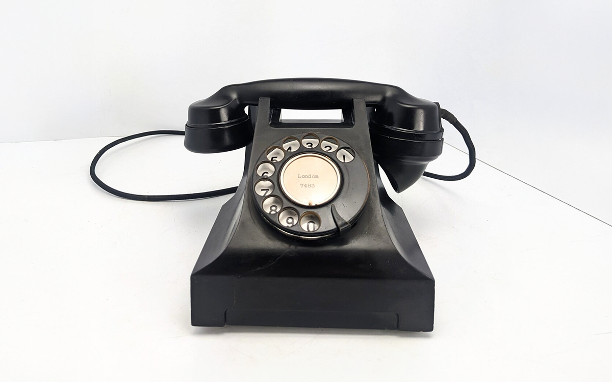 A vintage black rotary dial telephone