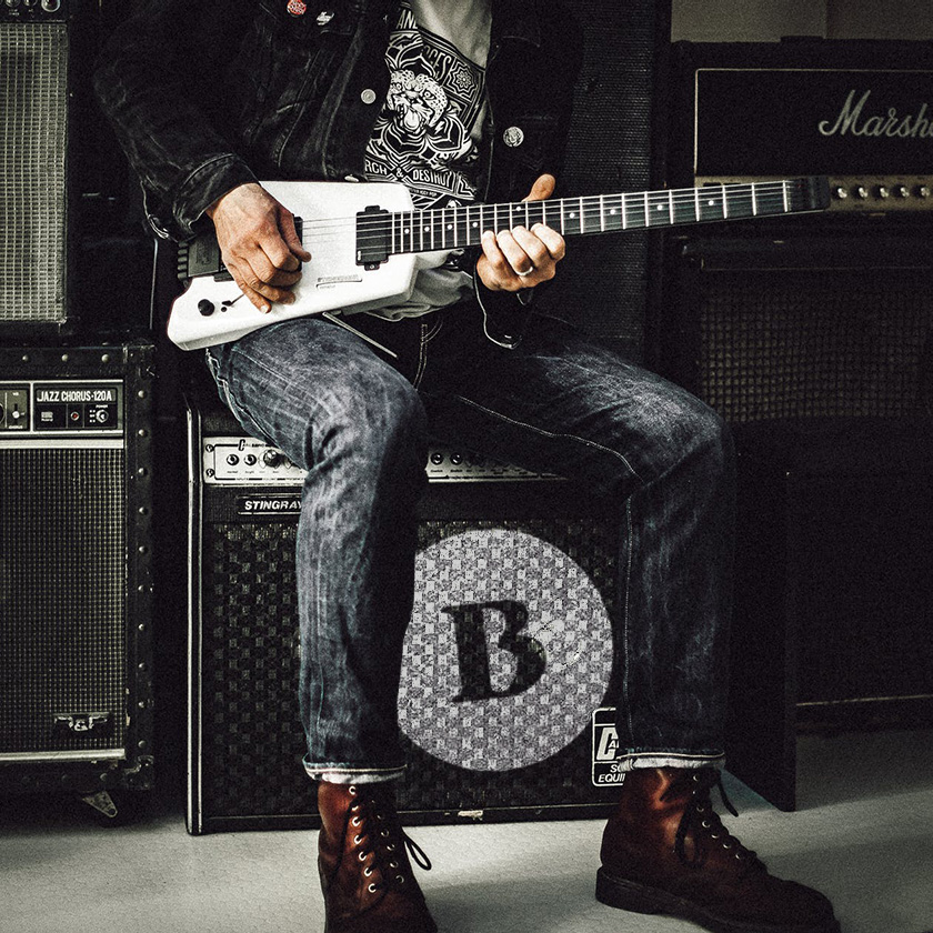 Black Stripe. Playing guitar and branded box with brand icon