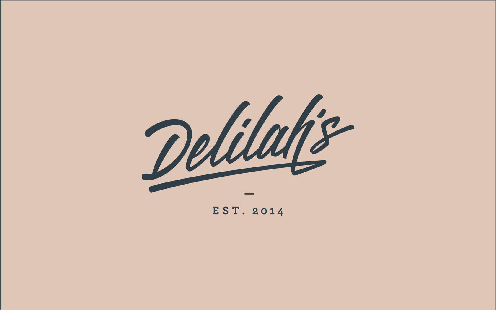 Delilah’s. Brand logo in charcoal blue on beige background