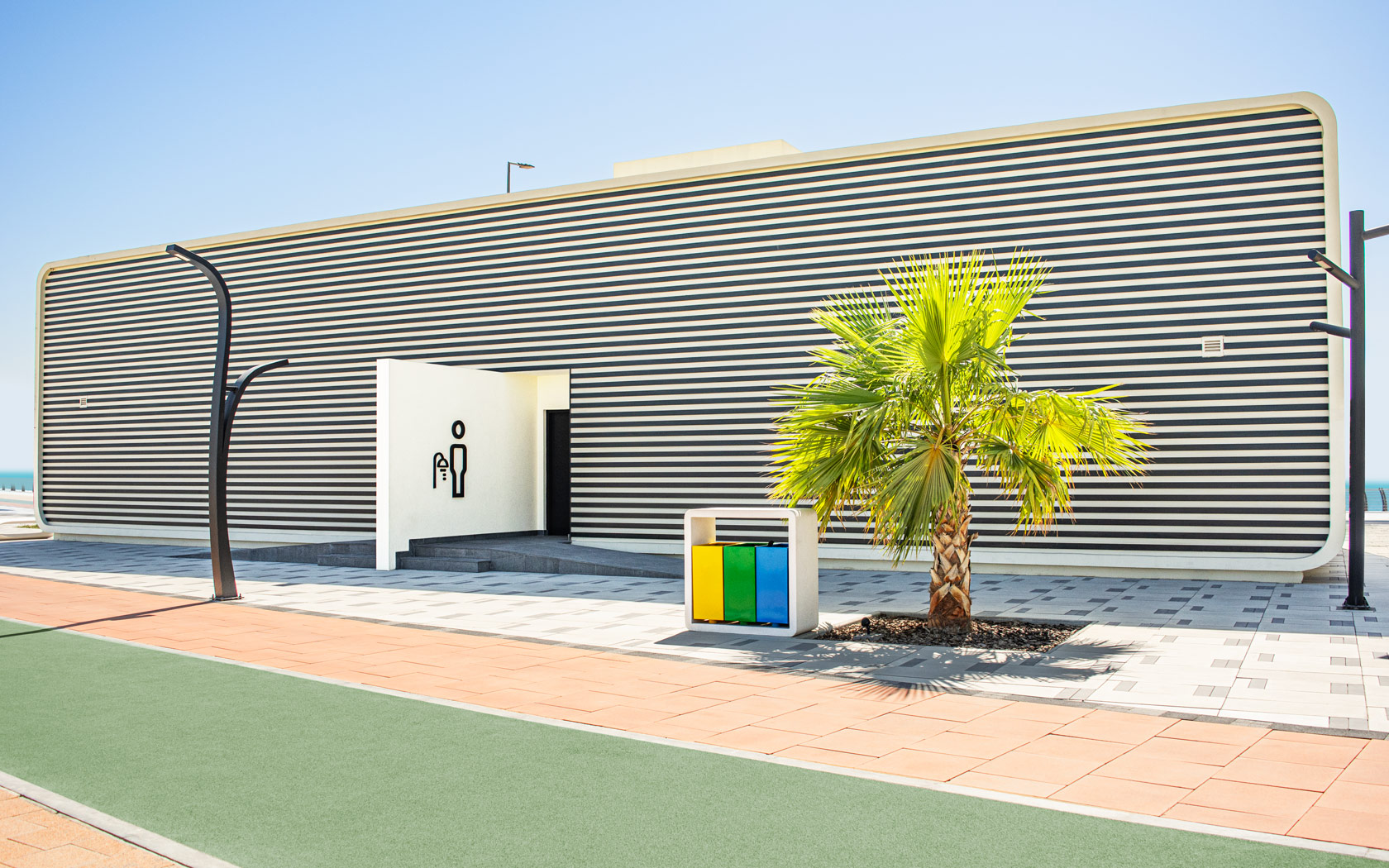 Shower Room building with entrance sign for Sama Bay.