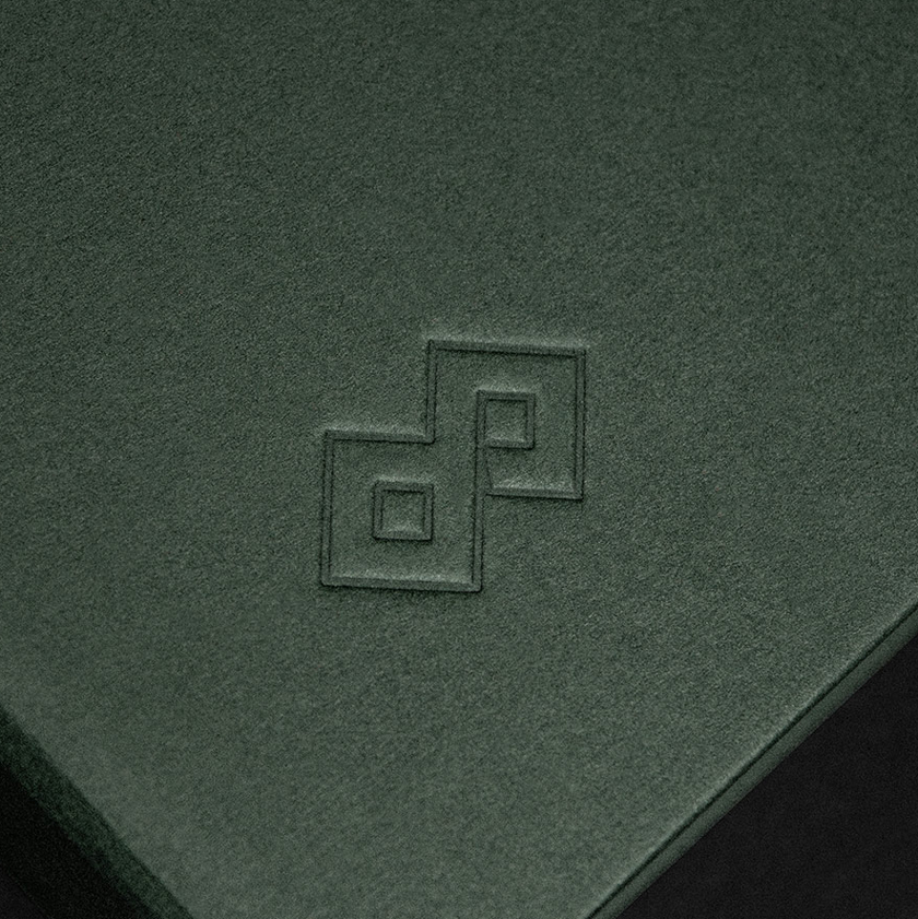 Logo detail pillow embossed into premium paper cover. 2026 Calendar By Unisono for GFH Financial Group.